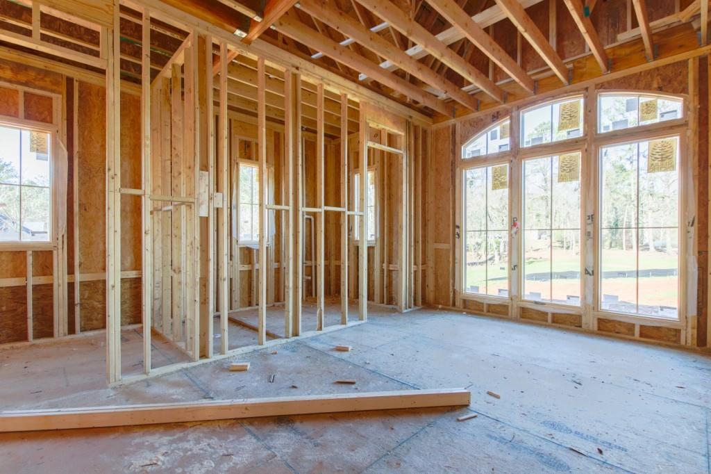 113 Hickory Flat Road Canton, GA 30115 - Photo 17 of 37 a view of an empty room with wooden floor and a window