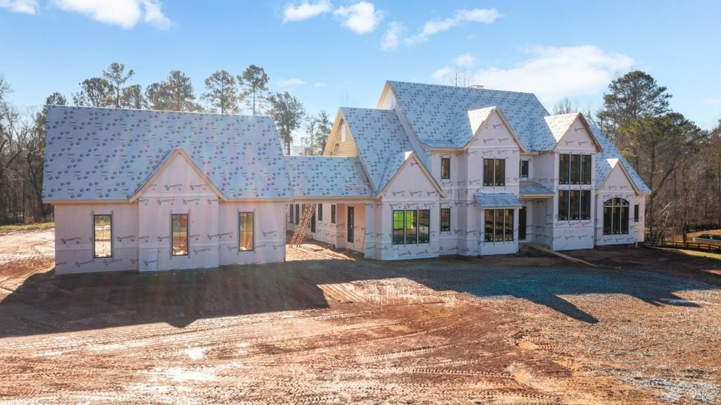 113 Hickory Flat Road Canton, GA 30115 - Photo 3 of 37 a view of a white house with a yard in the background