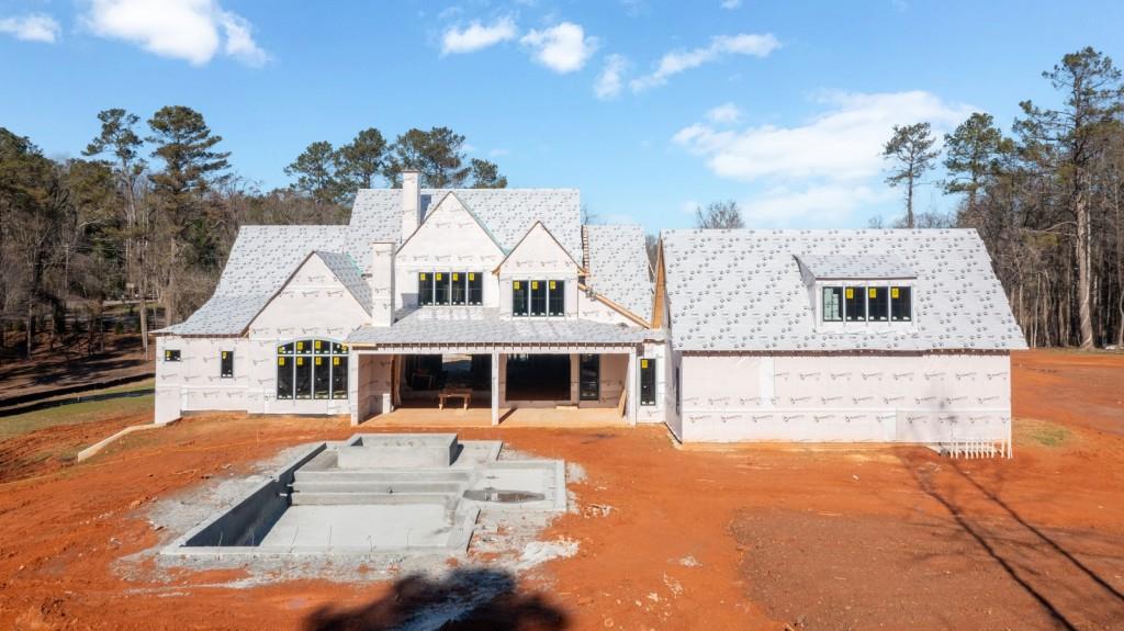 113 Hickory Flat Road Canton, GA 30115 - Photo 5 of 37 a view of a white house with a swimming pool