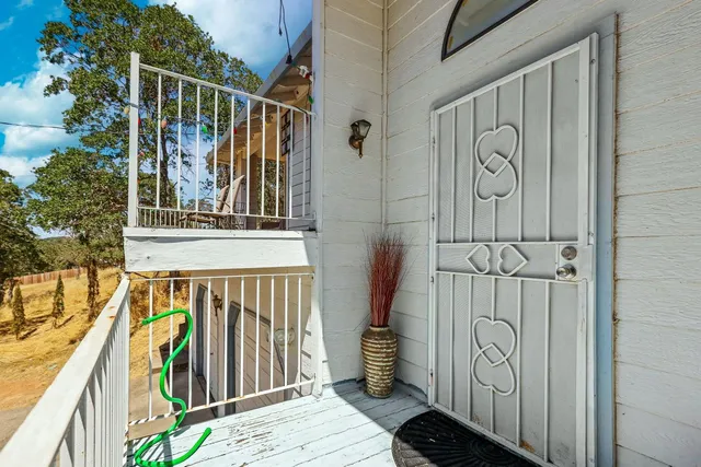 a view of a couches and dinning table in a livingroom