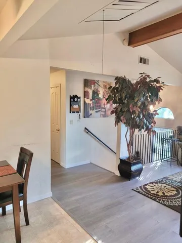 a living room with furniture flat screen tv and a fireplace