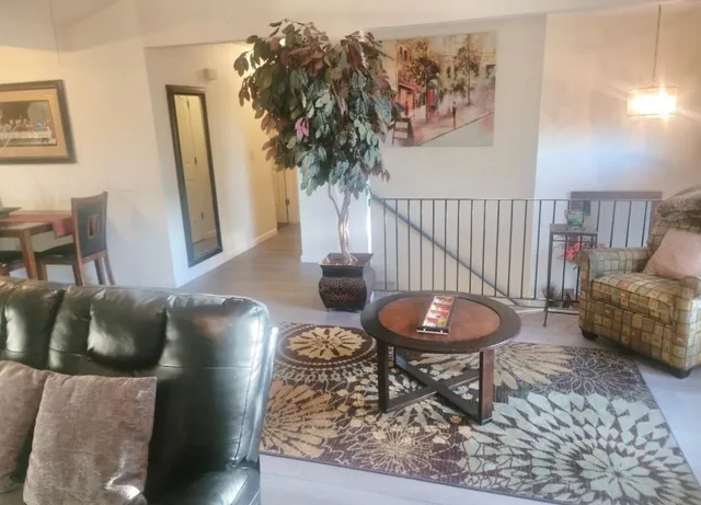 a kitchen with cabinets appliances a sink and a counter top space