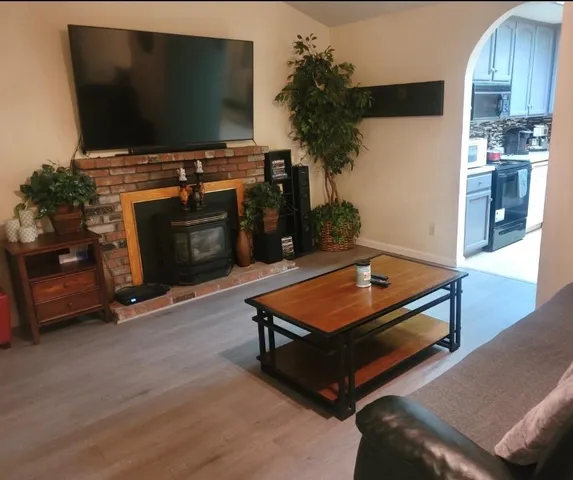 a kitchen with cabinets and chairs in it