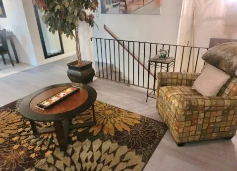 a kitchen with cabinets appliances a sink and a window