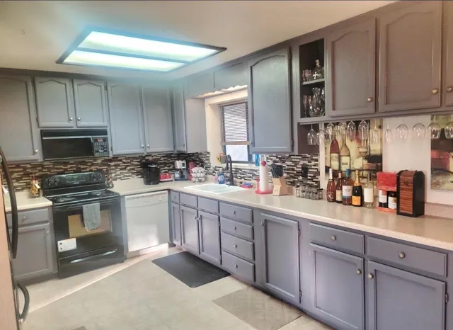 a kitchen with a table and chairs in it
