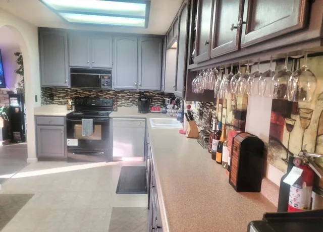 a view of a livingroom with furniture and a window