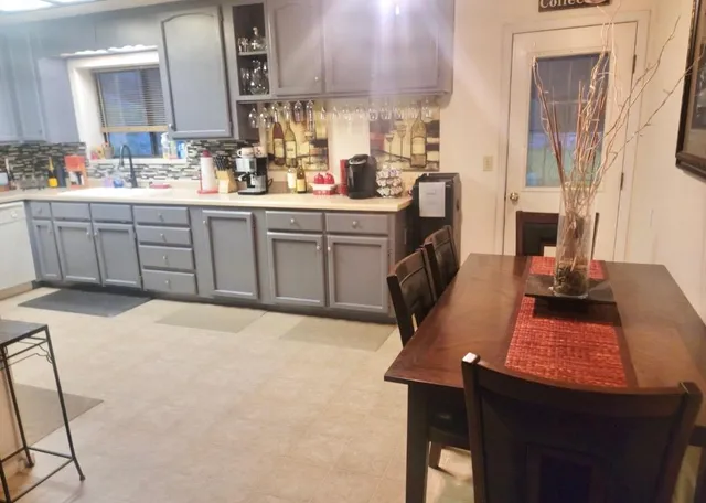 a view of a workspace room with wooden floor