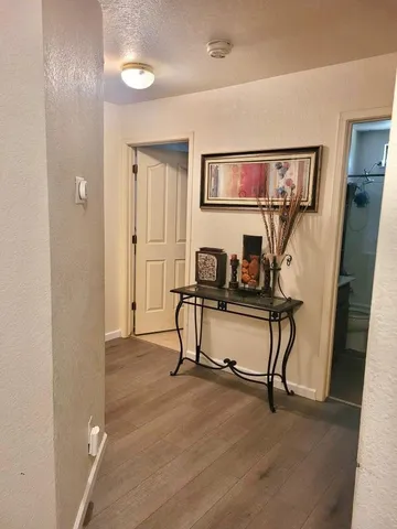 a view of walk in closet with clothes