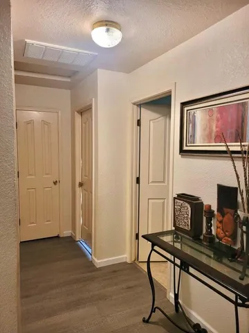 a bedroom with a bed and dresser in it