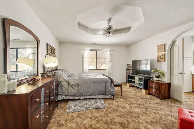 a view of a porch with chairs and backyard of the house