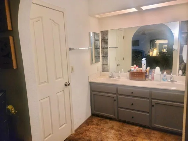 a view of a yard with wooden fence