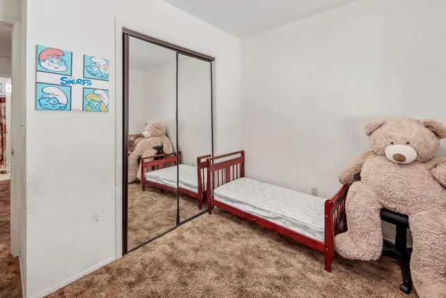 a view of a yard covered with snow in front of house