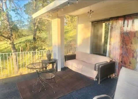 a view of a house with a balcony and door