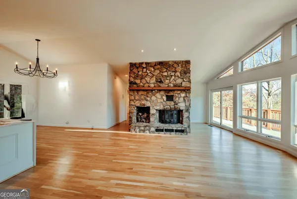 a view of kitchen and dining room with wooden floor