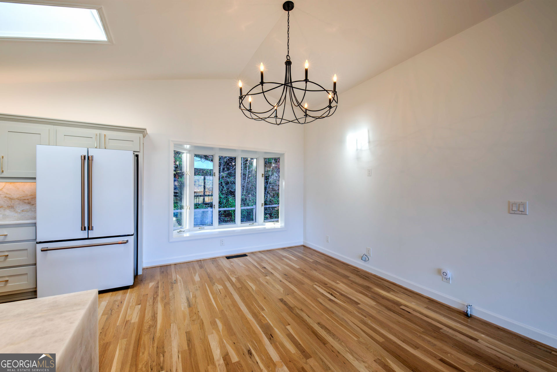 5019 Wolffork Road Rabun Gap, GA 30568 - Photo 21 of 52 a view of empty room with wooden floor and windows