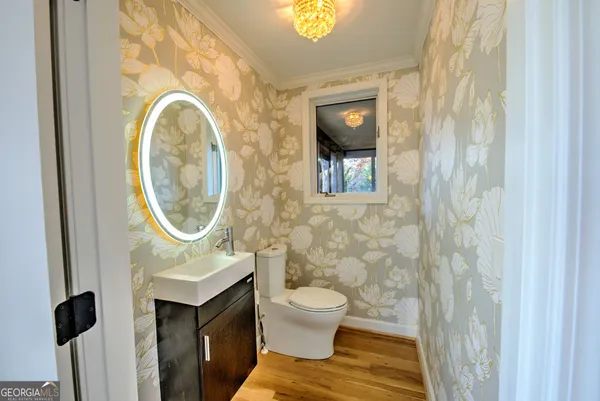 a bathroom with a toilet and a sink