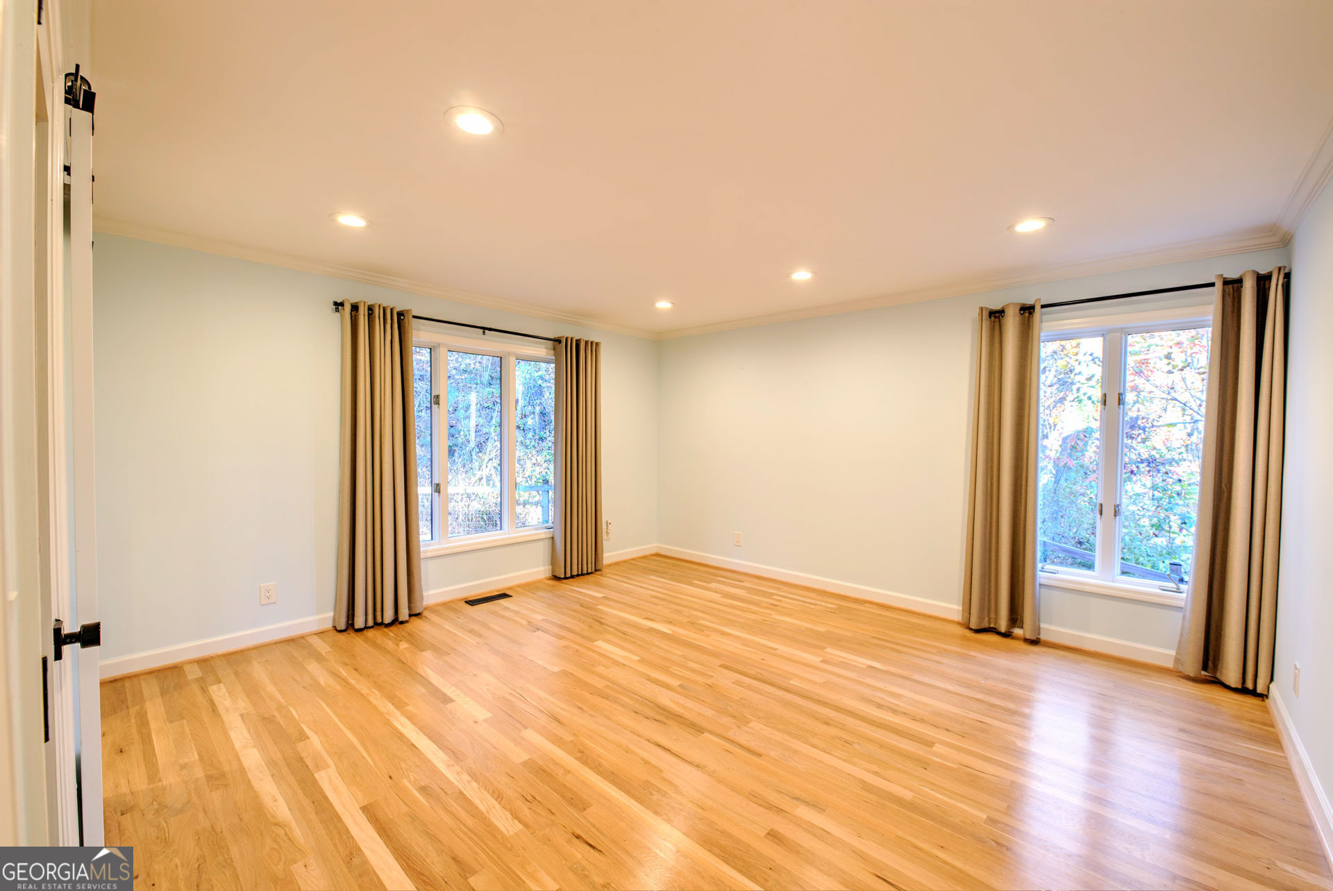 5019 Wolffork Road Rabun Gap, GA 30568 - Photo 26 of 52 a view of an empty room with wooden floor and a window