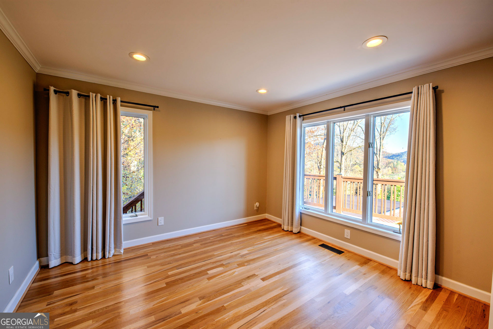 5019 Wolffork Road Rabun Gap, GA 30568 - Photo 29 of 52 a view of an empty room with wooden floor and a window