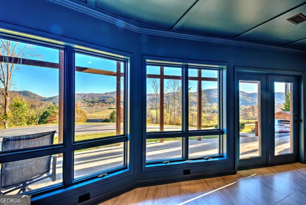 a view of a room with a large window