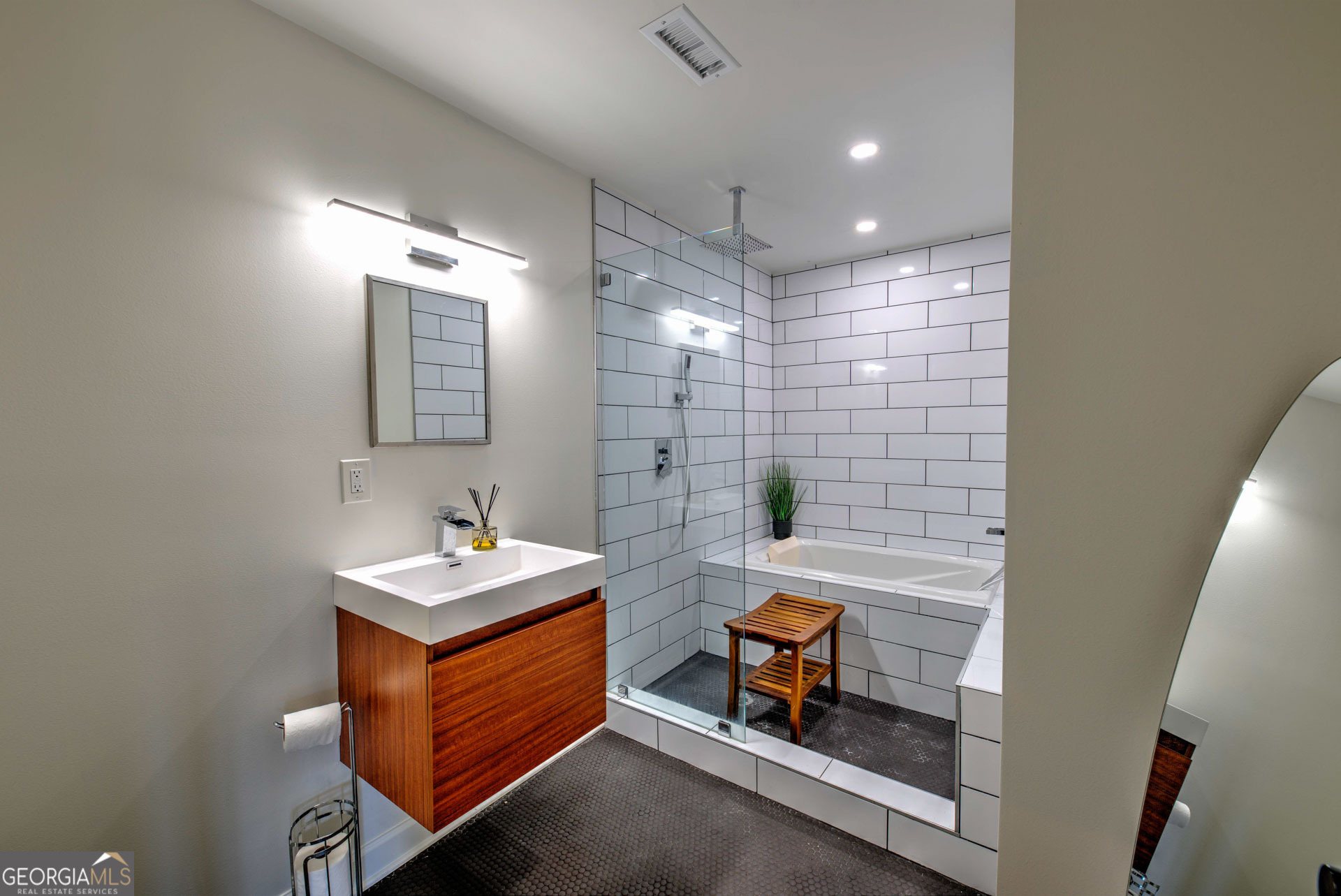 5019 Wolffork Road Rabun Gap, GA 30568 - Photo 36 of 52 a bathroom with a sink a toilet a mirror and shower