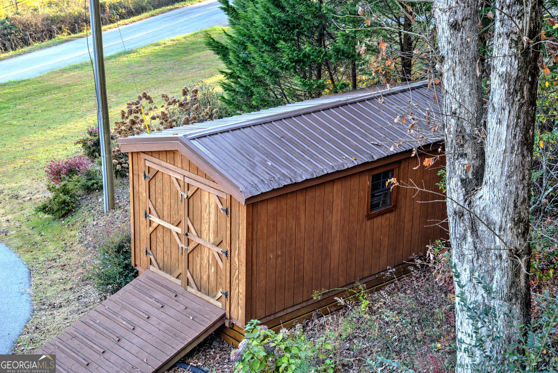 5019 Wolffork Road Rabun Gap, GA 30568 - Photo 40 of 52 a backyard of a house with lots of green space