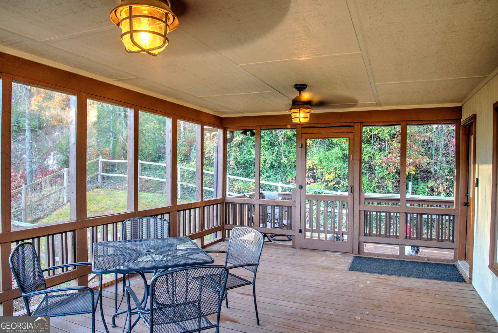 5019 Wolffork Road Rabun Gap, GA 30568 - Photo 8 of 52 a view of a dining room with furniture wooden floor and chandelier