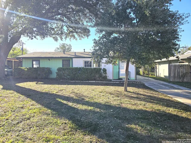 a view of a house with a yard tree s