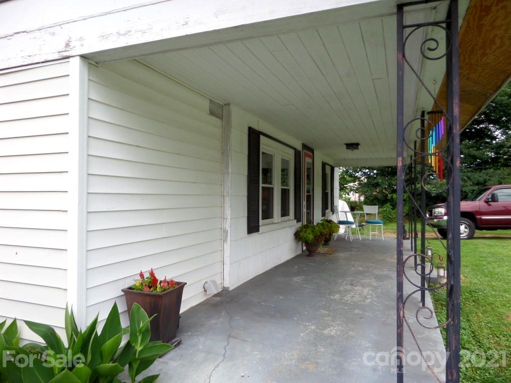 499 Oak Grove Road Flat Rock, NC 28731 - Photo 2 of 18 a view of a house with backyard and sitting area