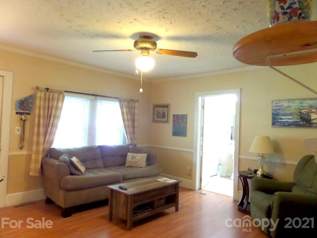 499 Oak Grove Road Flat Rock, NC 28731 - Photo 13 of 18 a living room with furniture and a large window