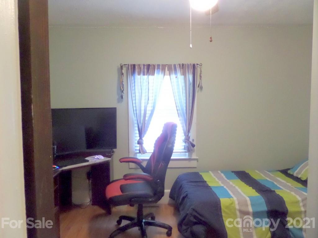 499 Oak Grove Road Flat Rock, NC 28731 - Photo 16 of 18 a view of a workspace with furniture and a window