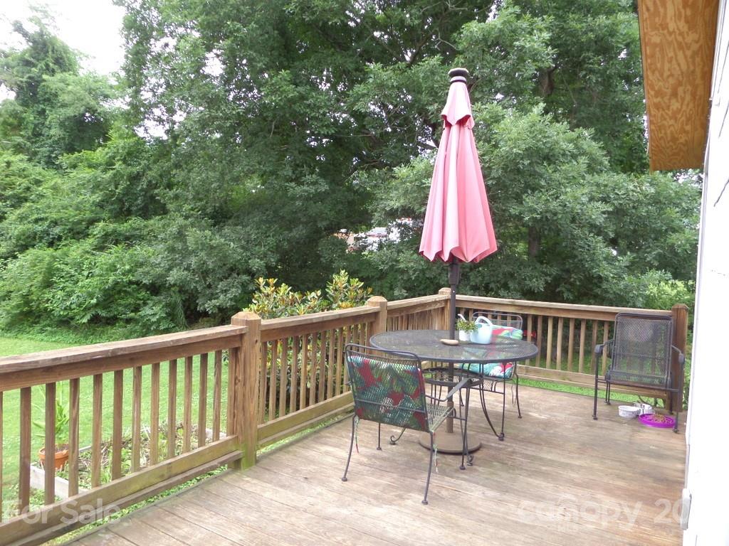 499 Oak Grove Road Flat Rock, NC 28731 - Photo 5 of 18 a view of a two chairs and table in the balcony