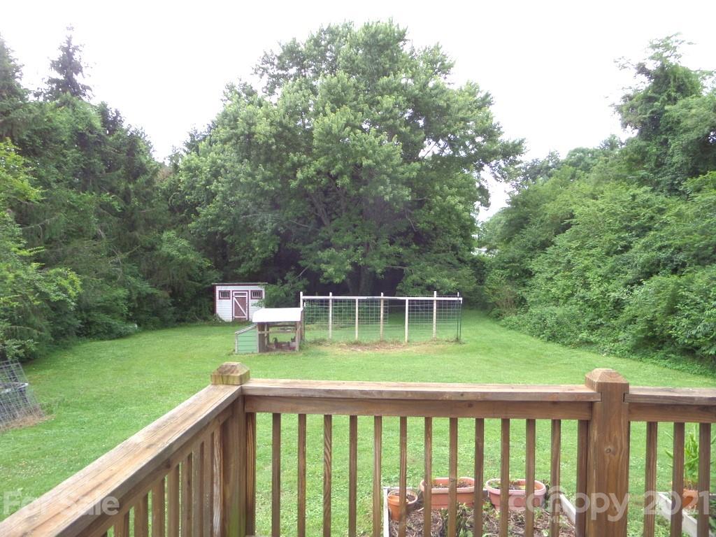 499 Oak Grove Road Flat Rock, NC 28731 - Photo 6 of 18 a house view with a garden