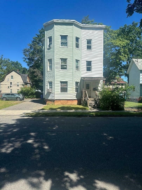 79 Keith Street Springfield, MA 01108 - Photo 2 of 37 a front view of a house with garden