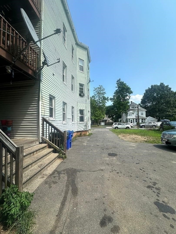 79 Keith Street Springfield, MA 01108 - Photo 33 of 37 a view of multiple houses with a yard