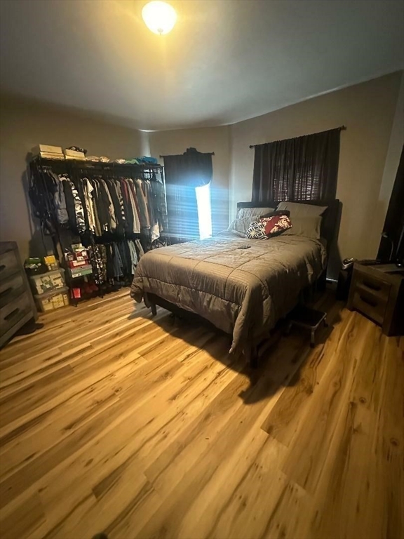 79 Keith Street Springfield, MA 01108 - Photo 6 of 37 a bedroom with double bed and a mirror