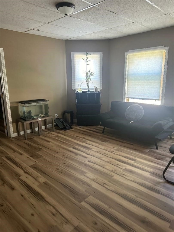 79 Keith Street Springfield, MA 01108 - Photo 9 of 37 a workspace with wooden floor and windows