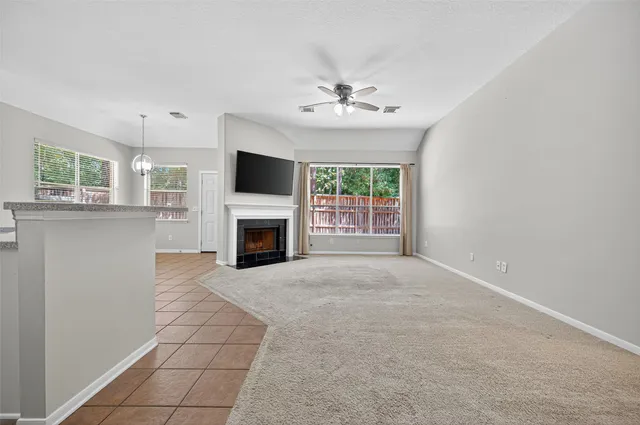 a view of an empty room with a fireplace