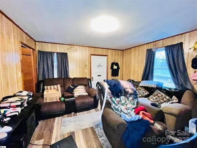 a living room filled with furniture and a window