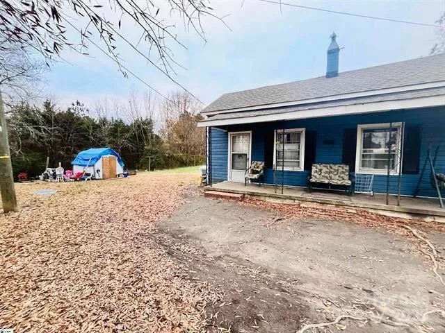 a view of a house with outdoor space and porch