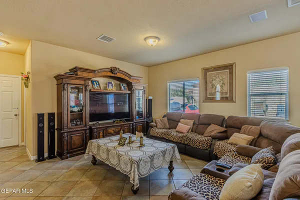 a living room with furniture and a table