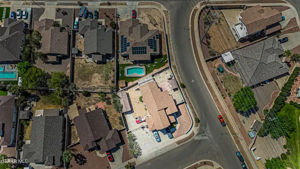 an aerial view of residential building and an ocean