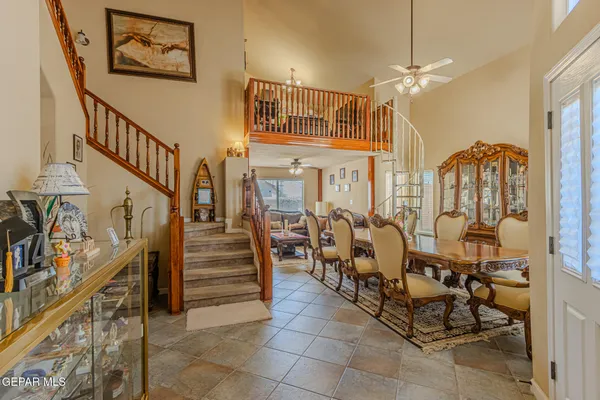 a view of a livingroom with furniture and staircase