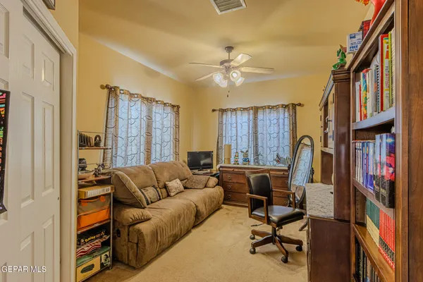 a view of a balcony with furniture