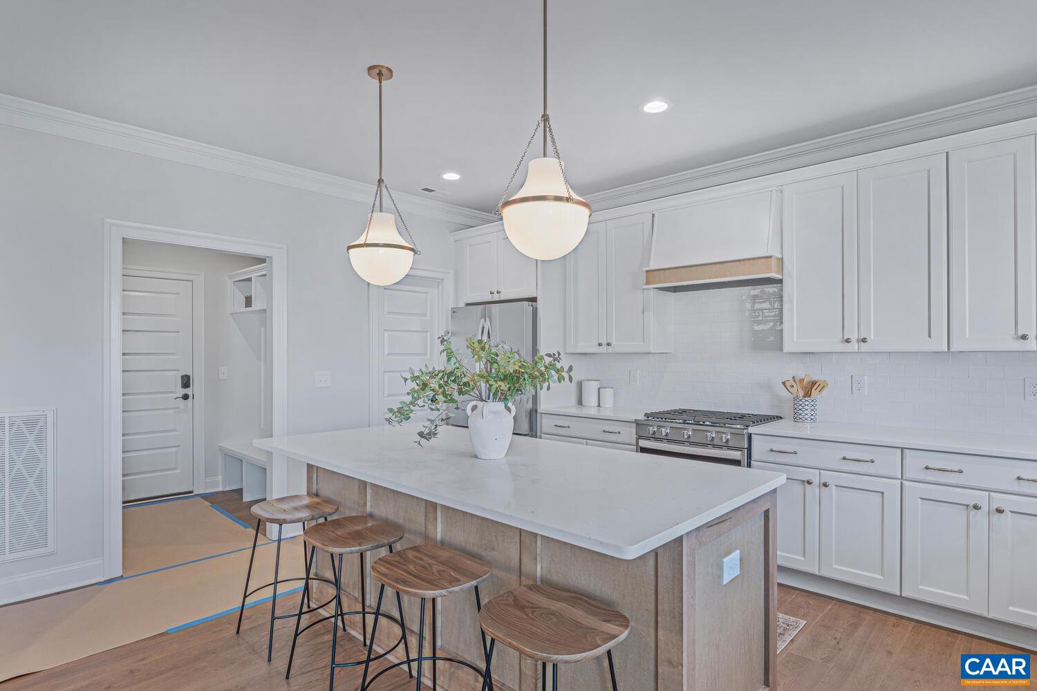 1731 Fowler Street Charlottesville, VA 22901 - Photo 16 of 45 a kitchen with a table and chairs in it