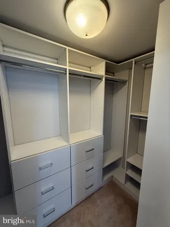 a view of an empty walk in closet