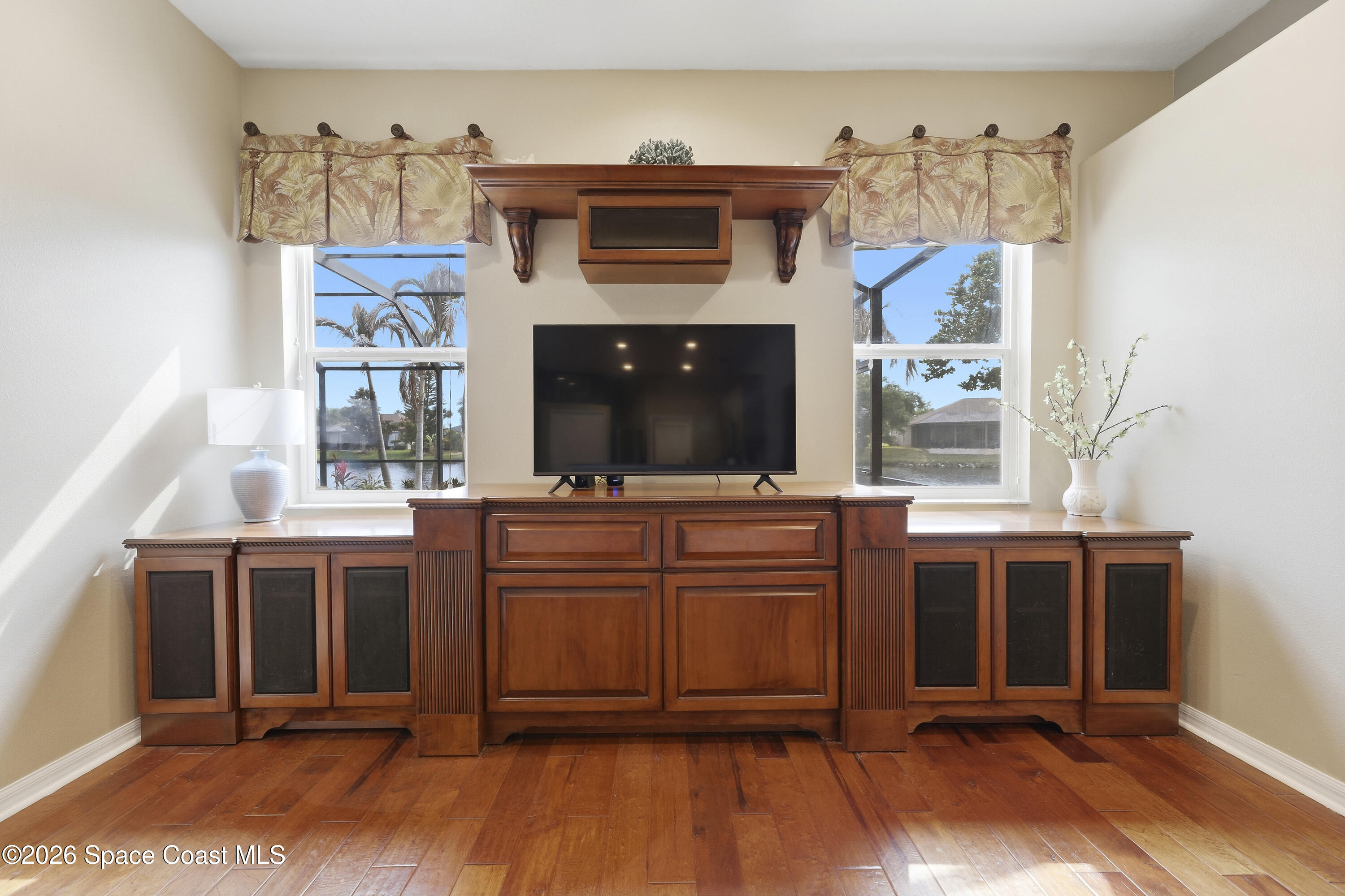 1643 Long Pine Road Melbourne, FL 32940 - Photo 15 of 63 a view of a kitchen area with furniture and fireplace