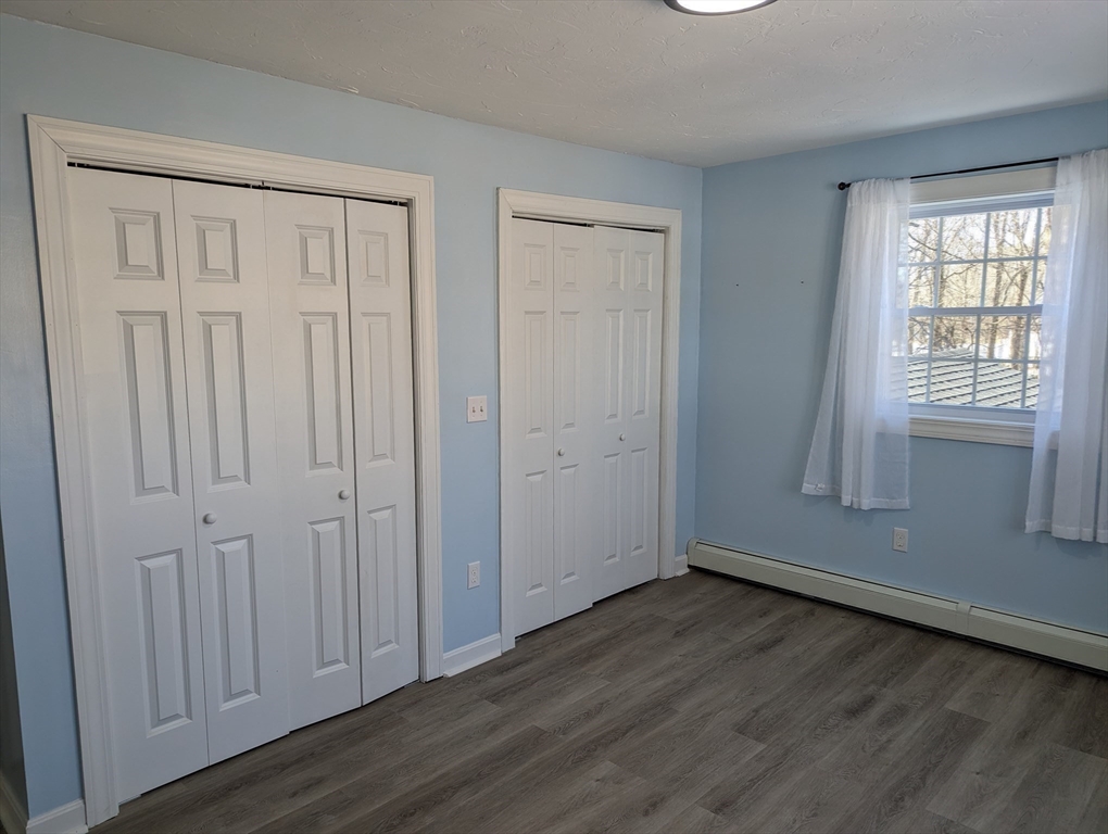 35 Carter Road Westminster, MA 01473 - Photo 14 of 20 an empty room with wooden floor and windows