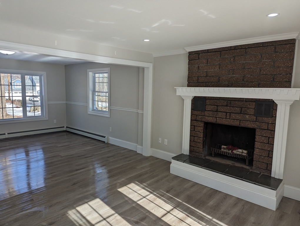 35 Carter Road Westminster, MA 01473 - Photo 7 of 20 a living room with wooden floor and a fireplace