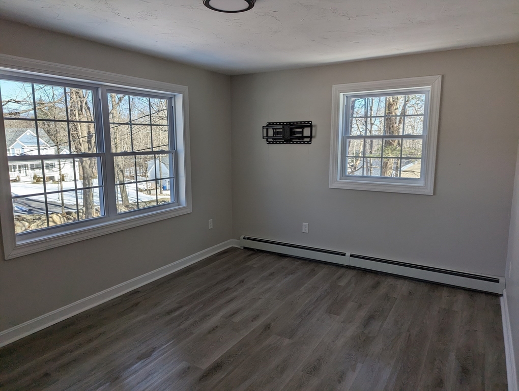 35 Carter Road Westminster, MA 01473 - Photo 10 of 20 a view of an empty room with wooden floor and a window
