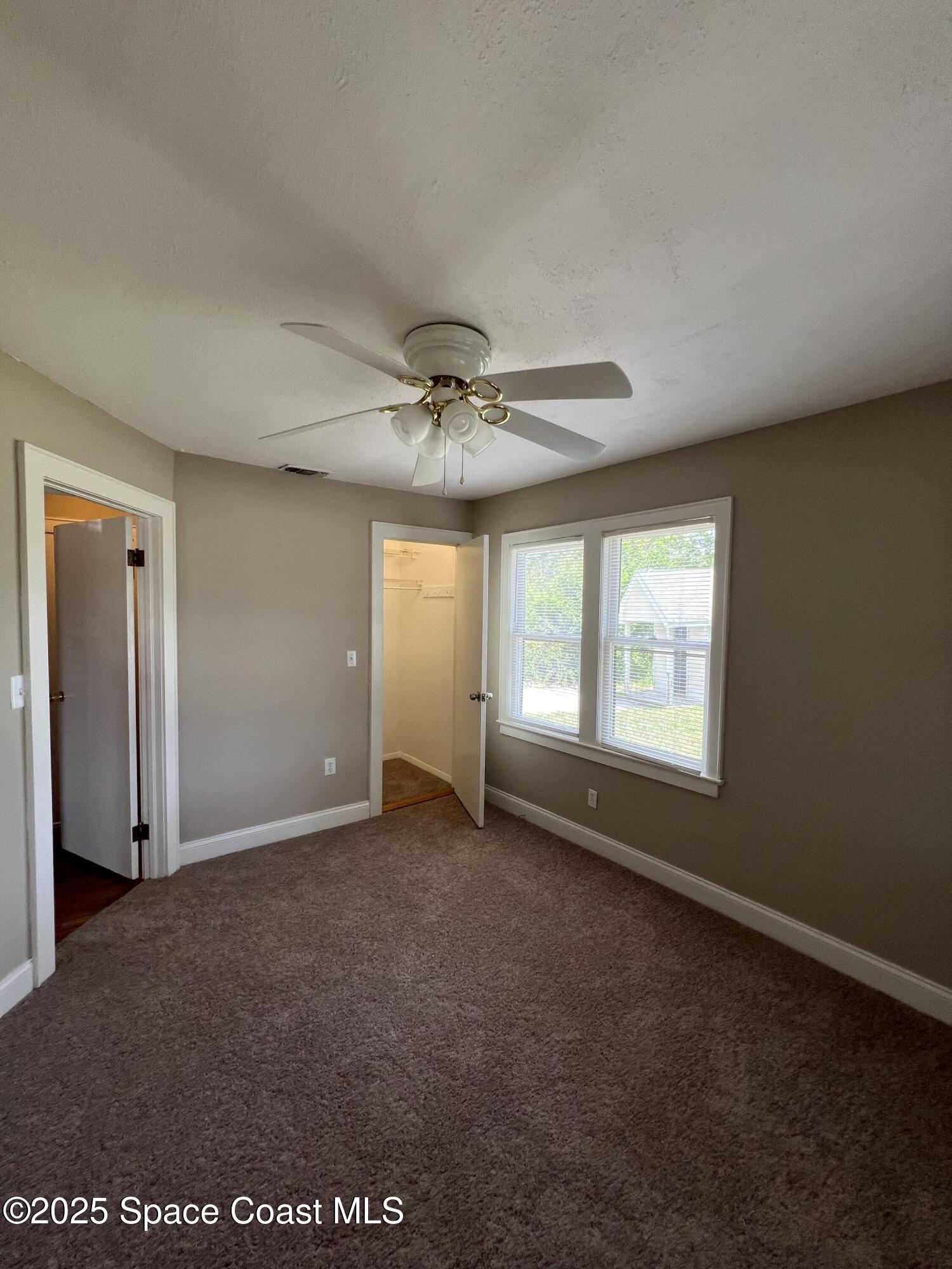 6500 June Drive Cocoa, FL 32926 - Photo 11 of 21 a view of an empty room with a window